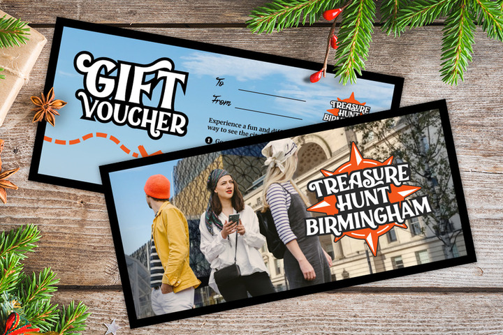 A gift voucher for Treasure Hunt Birmingham on a table covered with Christmas decorations