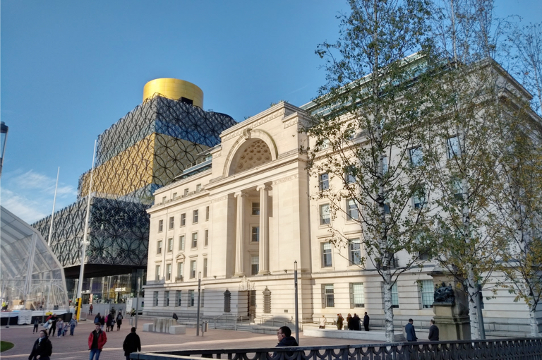 Centenary Square in the sunshine with the icon Library of Birmingham in the background